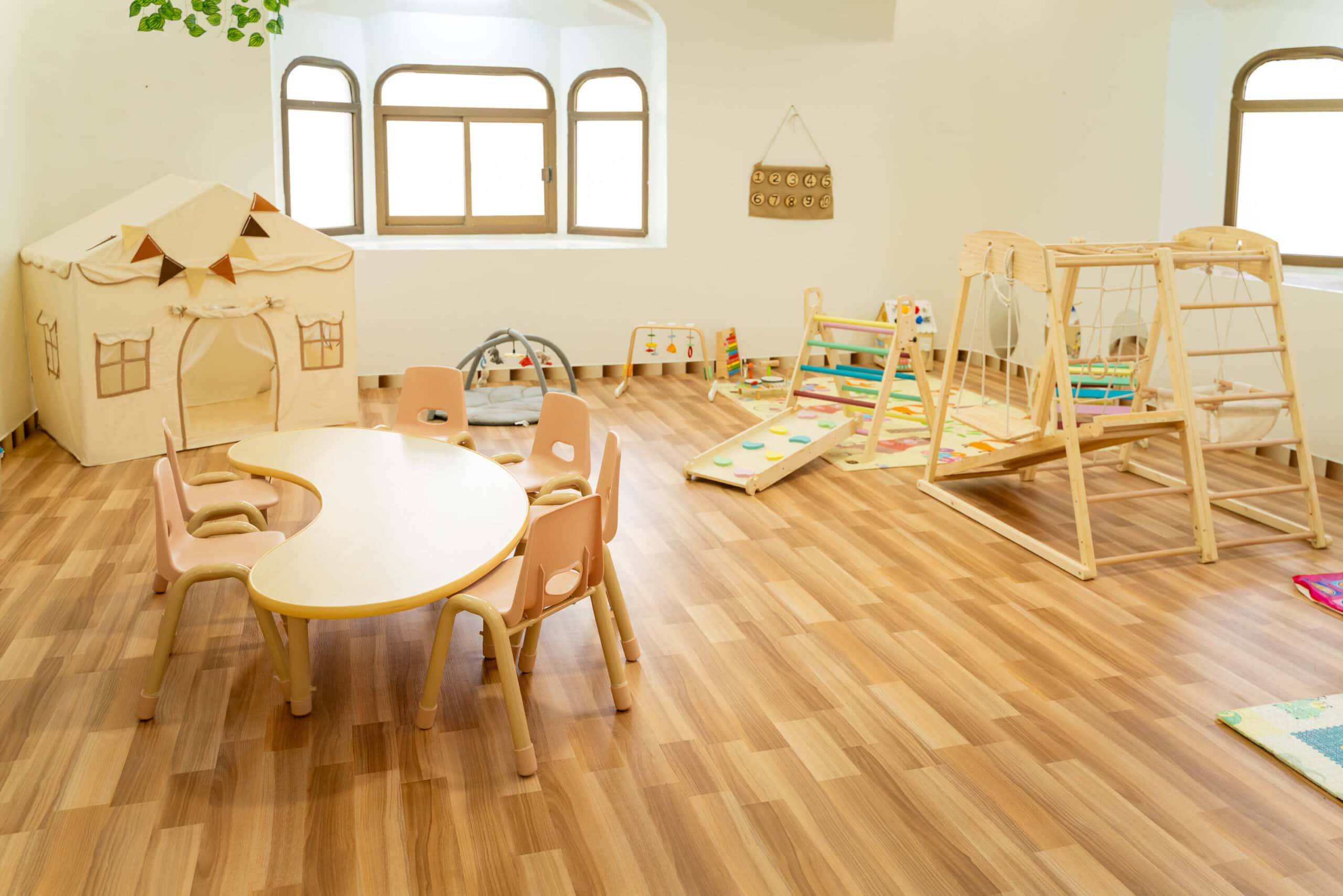 Classroom with a wooden play house at Tappy Toes Nursery Merashid, Fujairah